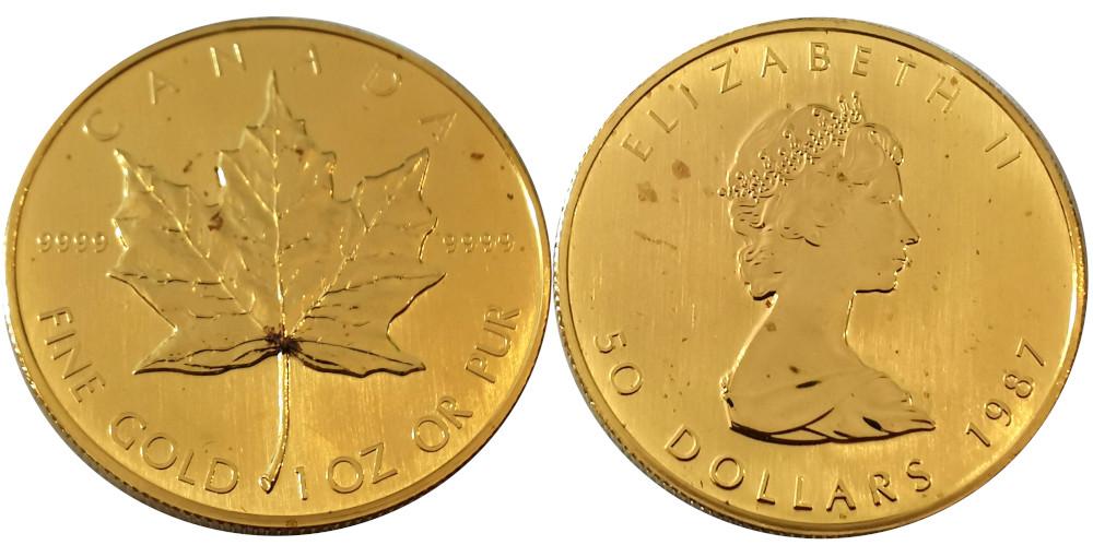 Bild einer 1 Unze Maple Leaf Münze von 1987 mit Ahornblatt und Könign Elisabeth I